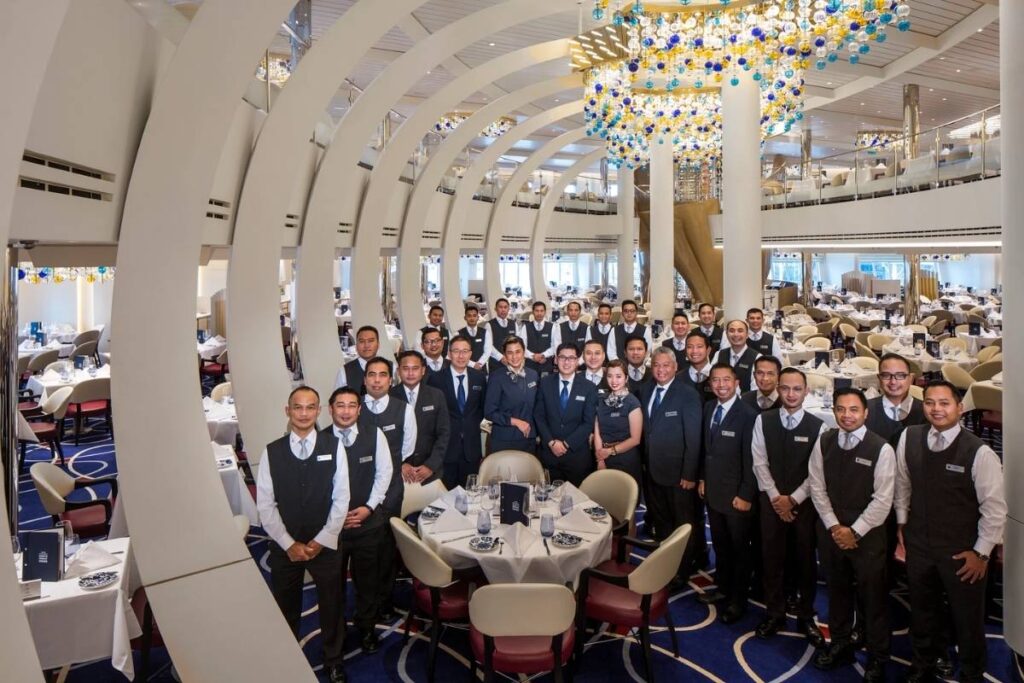 Holland America dining room staff gathered in the ship’s main restaurant.