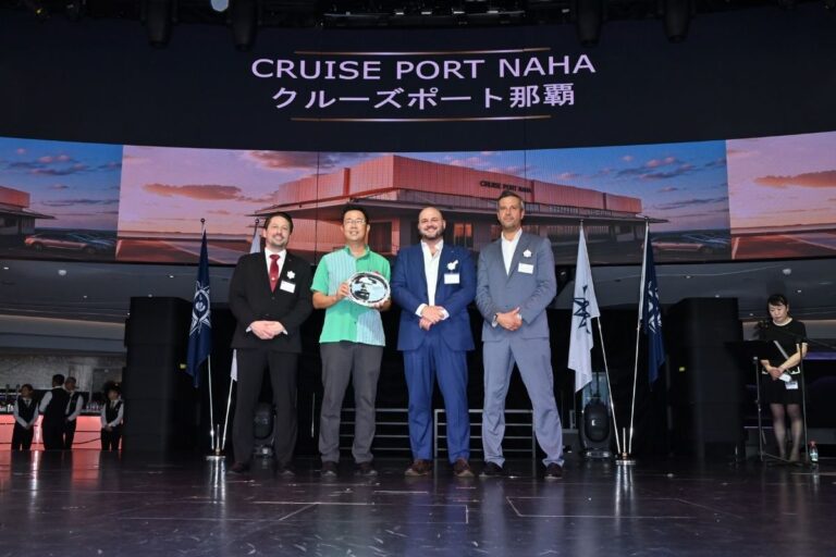Representatives from Royal Caribbean, MSC Cruises, and Okinawa pose at the Cruise Port Naha groundbreaking ceremony in Japan, with a rendering of the new cruise terminal behind them.
