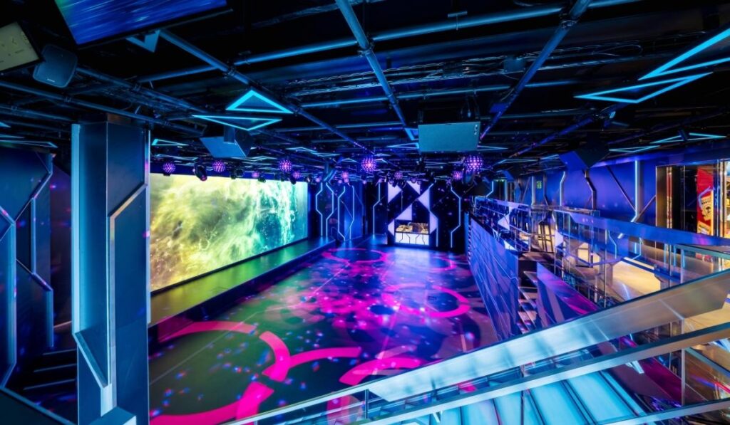 MSC Luna Park Arena with digital screens and colorful lighting.