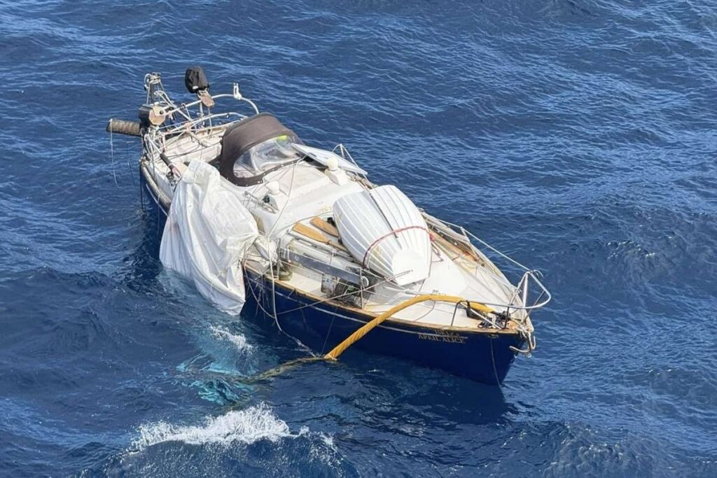 Disabled sailboat April Alice drifting in the Pacific Ocean after losing its mast before a Silver Whisper rescue