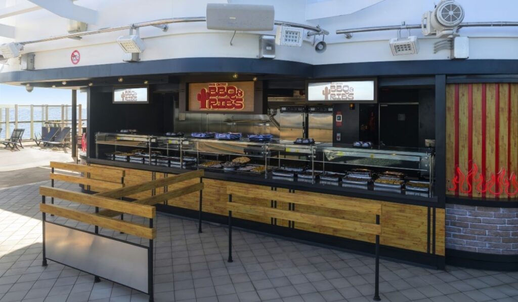 Red Cactus BBQ & Ribs outdoor serving area on MSC Seashore with buffet-style counters and branded signs.