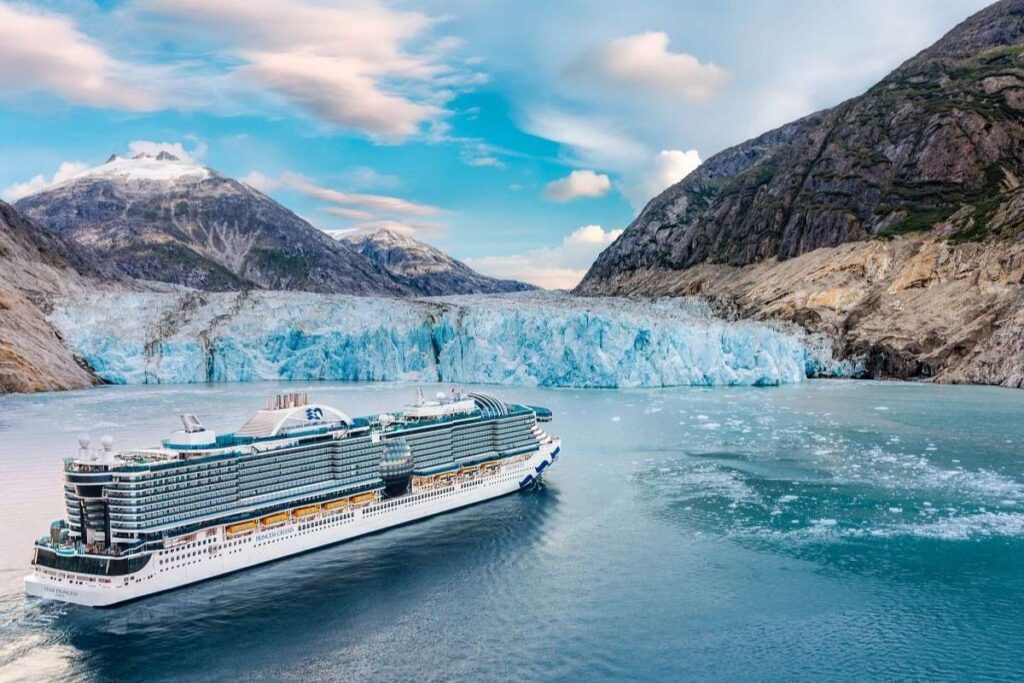 Star Princess cruise ship sailing near a Dewas Glacier in Alaska, illustrating glacier-viewing scenic cruising in Endicott Arm.