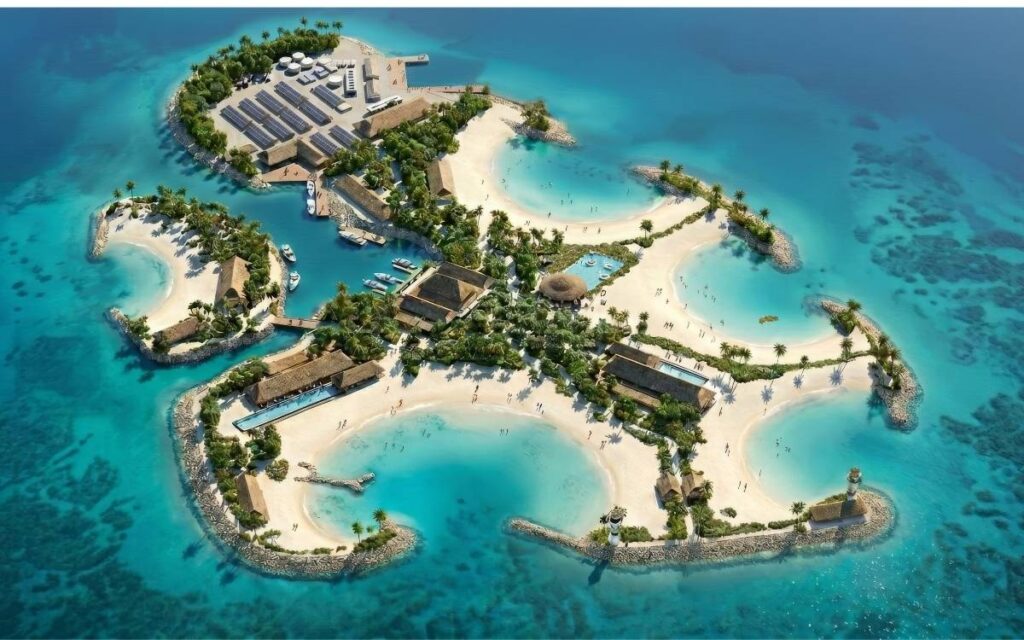Aerial rendering of MSC’s planned Sandy Cay private island in the Bahamas, showing white-sand beaches, turquoise lagoons, palm trees, and resort-style buildings.