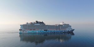 MSC Euribia cruise ship sailing on calm water under a clear blue sky.