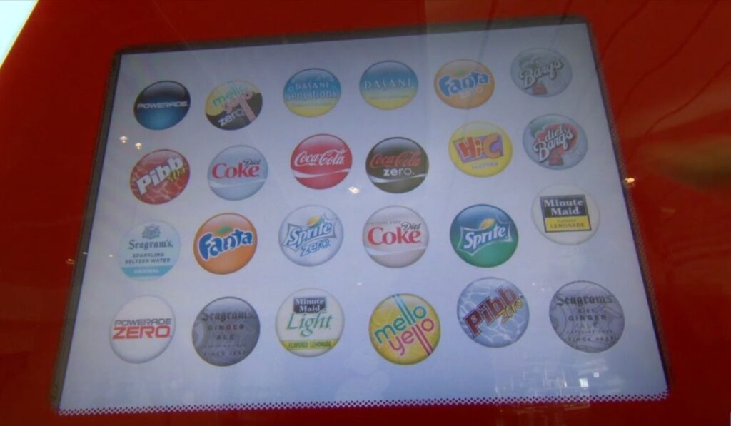 Coca-Cola Freestyle touchscreen shows a full menu of drink options, including Coke, Sprite, Fanta, Powerade, and Minute Maid.