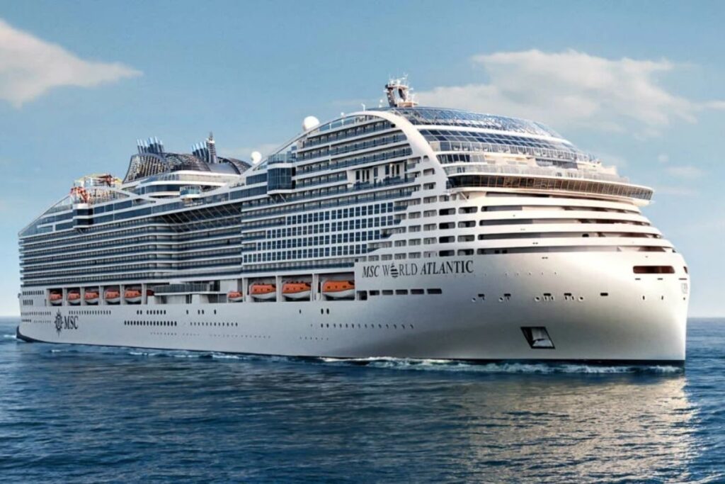 MSC World Atlantic cruise ship rendering sailing at sea under a blue sky.