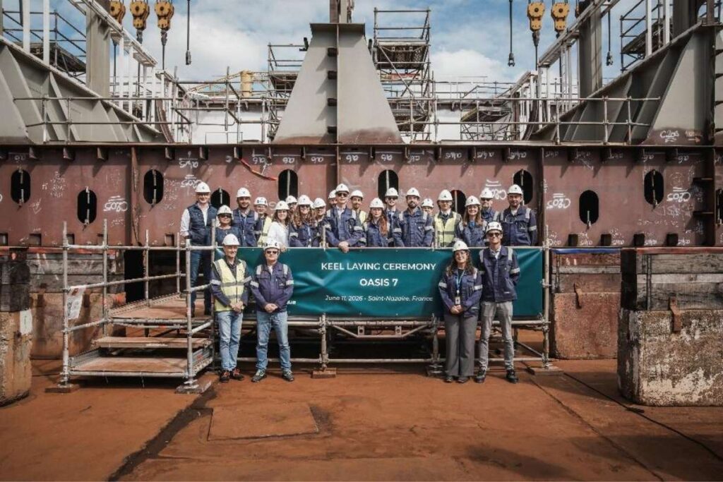Shipyard workers pose at the keel-laying ceremony for Royal Caribbean’s seventh Oasis-class cruise ship in Saint-Nazaire, France.