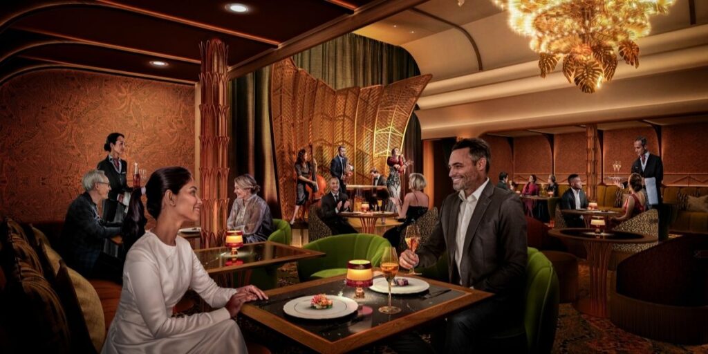 Guests seated at tables inside the Hollywoodland Supper Club on Legend of the Seas.