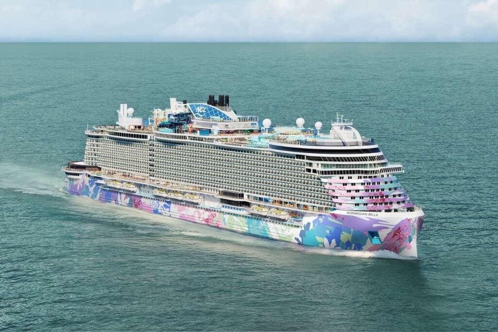 Artist's rendering of Norwegian Bella sailing at sea, showing the ship's colorful hull artwork designed by Australian artist George Rose.