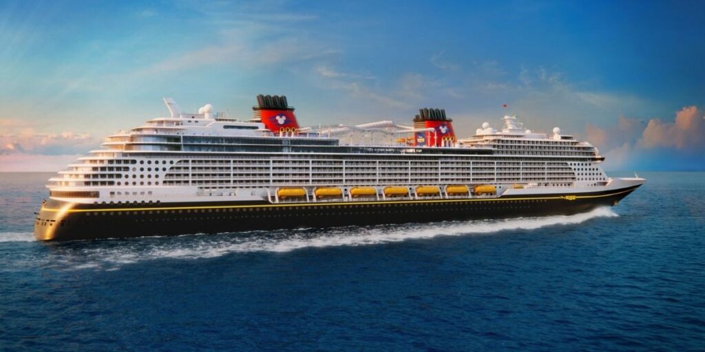 Artist rendering of Disney Believe sailing at sea, showing the ship's black hull, white decks, yellow lifeboats, and two red Disney Cruise Line funnels.