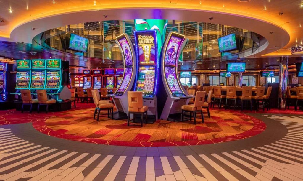 The vibrant casino on the Carnival Horizon cruise ship, featuring a variety of slot machines and gaming tables, with dynamic lighting and a lively atmosphere.