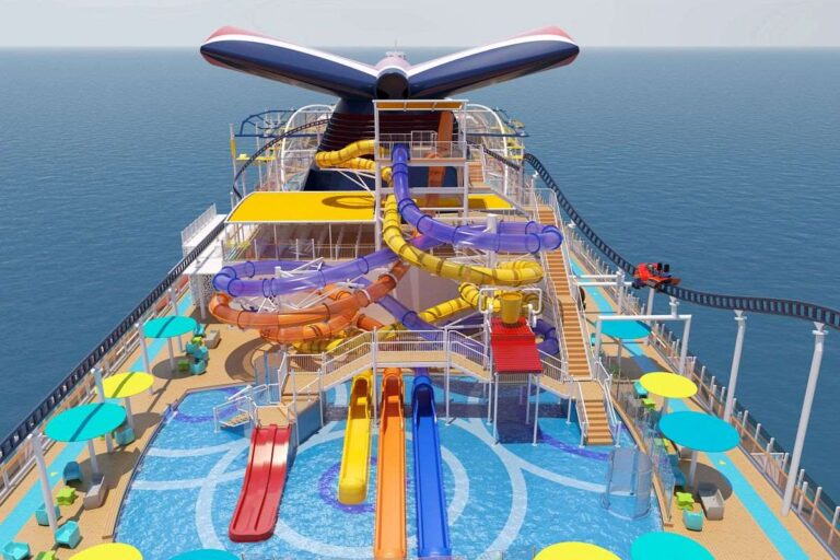WaterWorks on Mardi Gras, a vibrant aquatic playground with multiple colorful waterslides, splash areas, and spacious decks, all under the watchful eye of the ship's distinctive winged funnel.