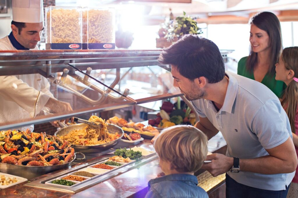 A cheerful family trying out the onboard buffet of costa cruises