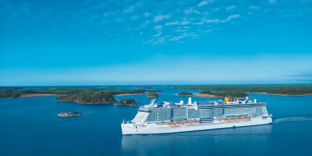 Costa Smeralda hovering the ocean with small islands behind it