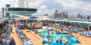 Pool deck on a cruise ship with a ton of cruise ship passengers on enjoying