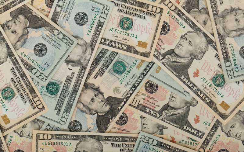 A photo of 20 dollar notes spread out.