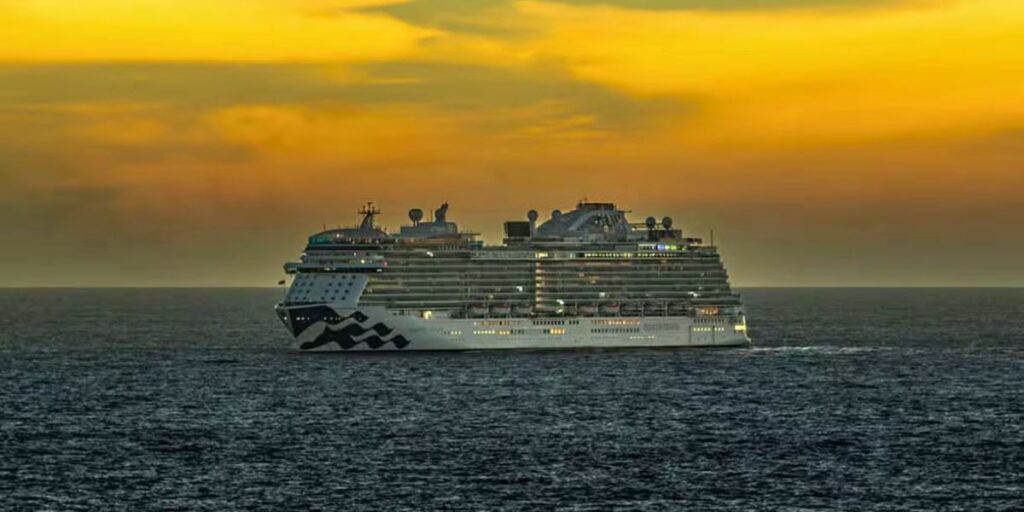 Enchanted Princess sailing on the ocean at sunset