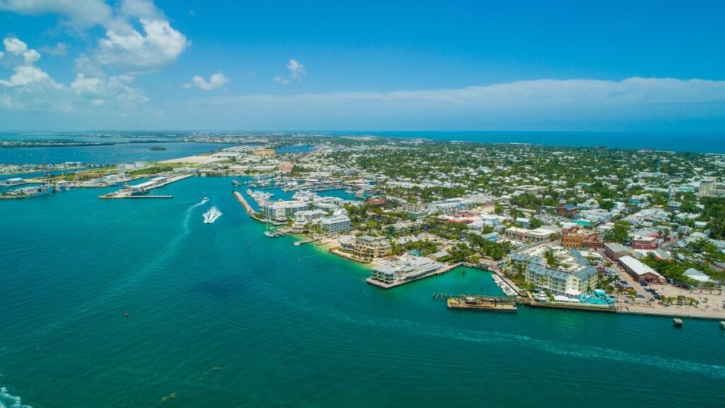 An aerial photo of Key Wet in Florida. Looking over the land, towns and blue sea.