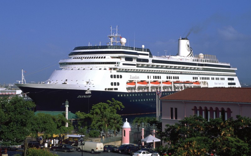 A photo the the MS Zaandam, Holland America Ship, docked at a port.