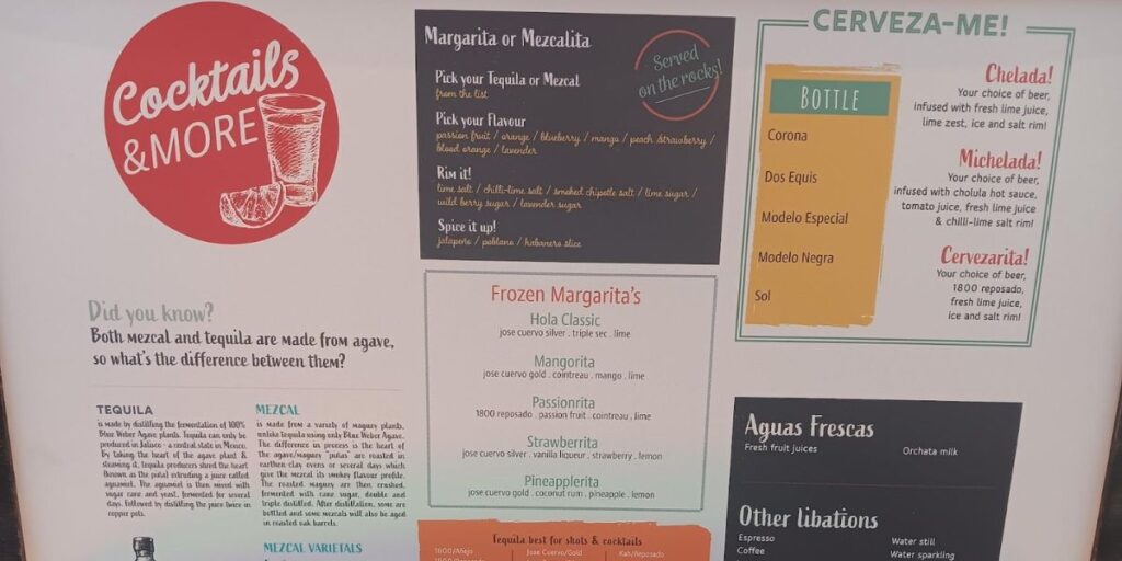 A beverage menu titled 'Cocktails & More' with a section 'Did you know?' explaining the difference between mezcal and tequila. Options include 'Margarita or Mezcalita' customizable with flavors like blueberry, mango, and lavender; 'Frozen Margaritas' in varieties such as Hola Classic and Passionrita; and a 'CERVEZA-ME!' section featuring bottled beers like Corona and Dos Equis, along with beer cocktails like Chelada and Michelada. Additionally, 'Aguas frescas' with fresh fruit juices and 'Other libations' like espresso and various waters are listed.
