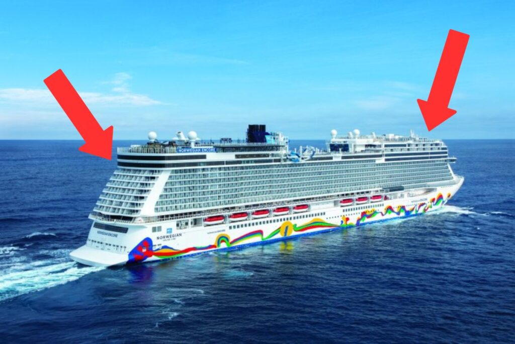 The Norwegian Encore cruise ship is shown with red arrows pointing to cabins located at the front and back of the ship, which are considered worse for seasickness. These areas are more prone to motion and can exacerbate seasickness for sensitive passengers. The ship features colorful exterior artwork and numerous balconies.