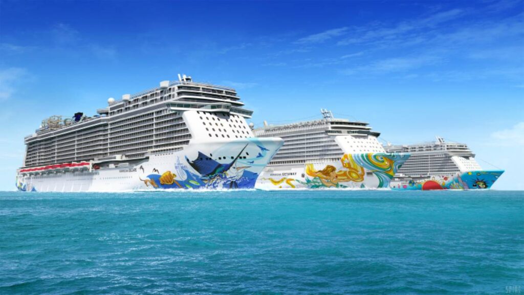 Three Norwegian Cruise Line ships at sea, featuring vibrant, artistic hull designs with marine motifs, symbolizing the lively and colorful experience offered aboard these floating resorts.
