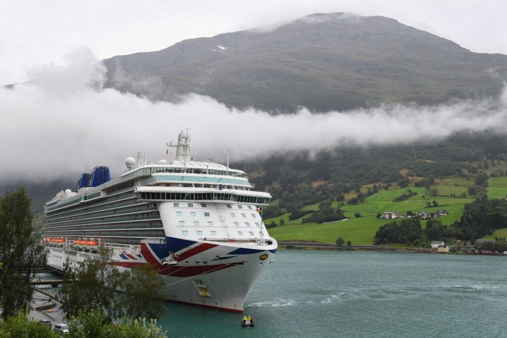  A P&O Cruises ship docked in calm waters.