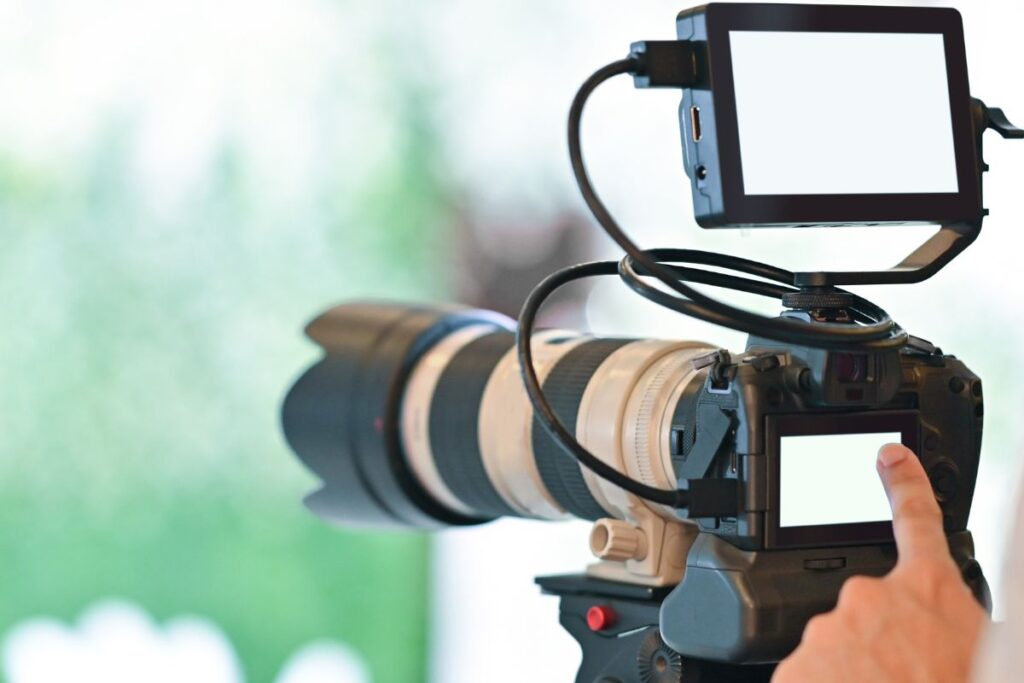 Cruise photographer fixing the overexposed setting on his camera before shooting