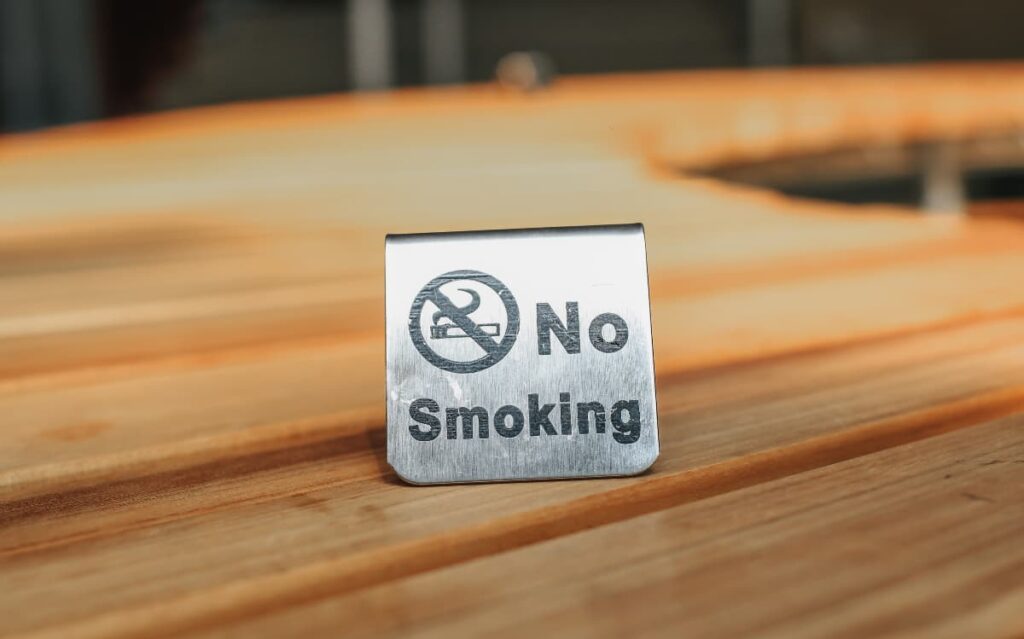 No smoking sign emphasizes cruise balcony rules.