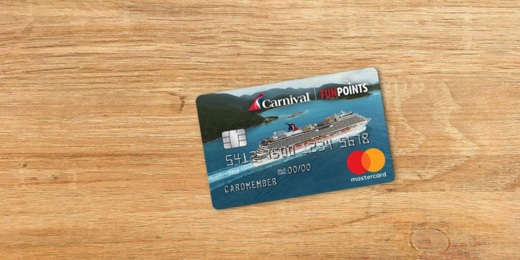 A Carnival Mastercard featuring the branding 'FunPoints' and an image of a cruise ship sailing in blue waters with lush green islands in the background. The card is placed on a wooden surface, highlighting its travel rewards theme.