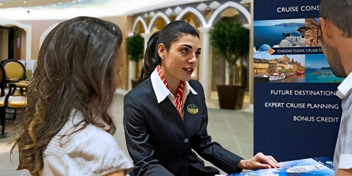 A cruise concierge assists a couple with their travel plans, providing information and brochures at a cruise terminal. A poster behind her highlights services such as future destinations, expert cruise planning, and bonus credit options, enhancing the vacation experience for travelers.