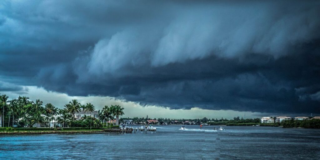 A huge hurricane cloud approaching an island near the sea