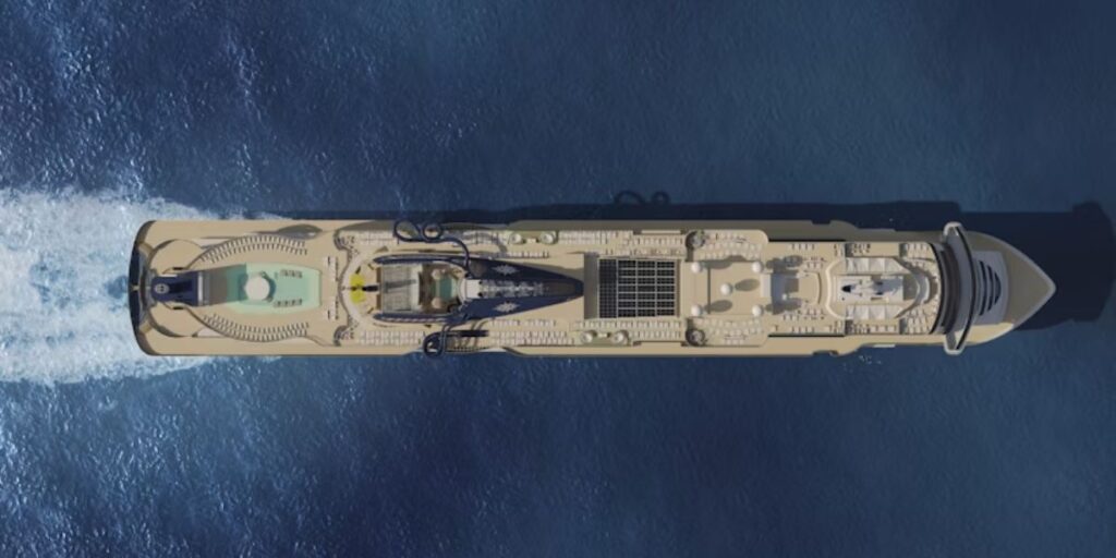 An aerial view of a large cruise ship, possibly the MSC Seascape, showcasing its expansive deck with multiple pools, lounging areas, and the intricate design of the upper decks as it cuts through the deep blue ocean, leaving a white wake behind.