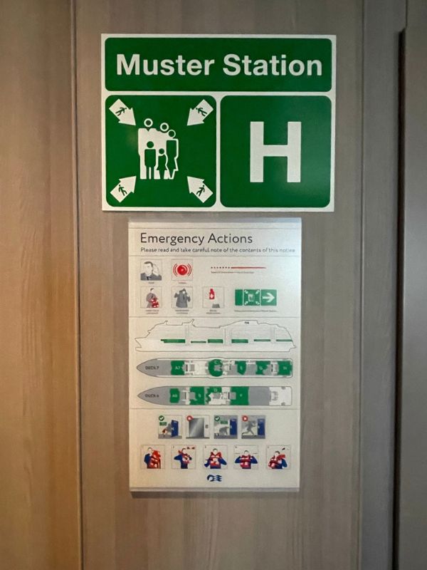 A photo of the signage used for a muster station on a cruise ship.