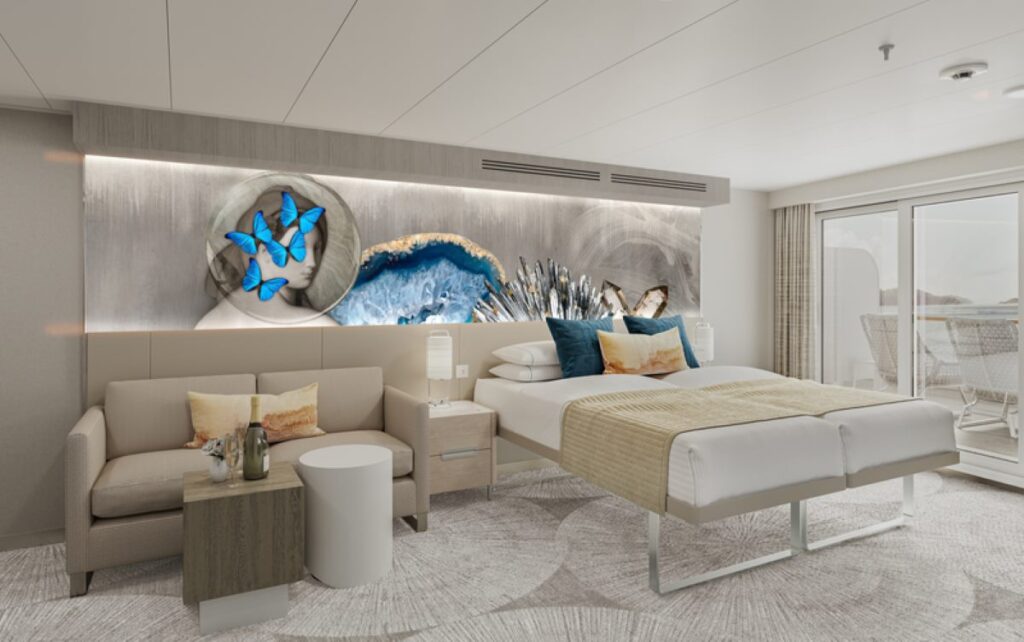 The Club Balcony suite on the NCL Prima features a modern, stylish design with a large bed, a comfortable sofa, and a private balcony. The room is decorated with elegant artwork, including a striking piece with blue butterflies, and provides ample natural light through the sliding glass doors leading to the balcony. The suite offers a luxurious and relaxing atmosphere for guests.