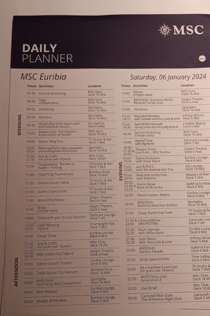 The image shows a detailed Daily Planner for MSC Euribia cruise ship activities. The schedule is divided into Morning, Afternoon, and Evening sections with various activities like Sunrise Stretching, Yoga, Aerobics, Game: Ring Toss, MasterChef@Sea, LGBT Meeting, Beer Festival, and live performances. Specific locations on different decks for each event are provided, alongside times ranging from early morning activities starting at 7:30 AM to late-night events ending at midnight. Charges apply for certain activities. The planner is for Saturday, 06 January 2024.