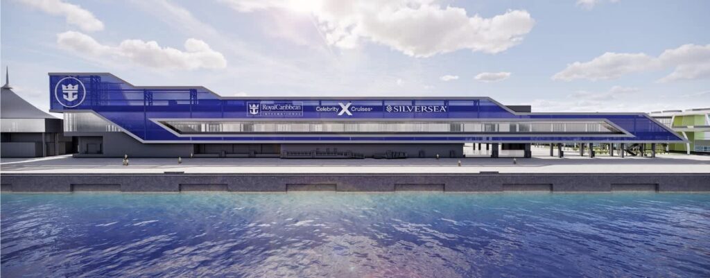 Exterior view of Royal Caribbean’s new cruise terminal with sleek blue branding, including logos for Royal Caribbean, Celebrity Cruises, and Silversea, overlooking the waterfront with a clear, sunny sky.