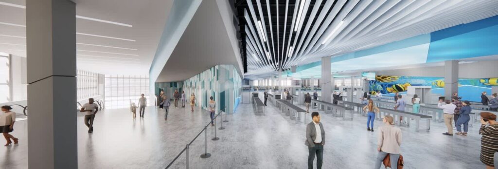 Spacious and brightly lit cruise terminal interior with multiple security lanes, people queuing at check-in, and colorful marine-themed murals on the walls, including vibrant fish and underwater scenes.